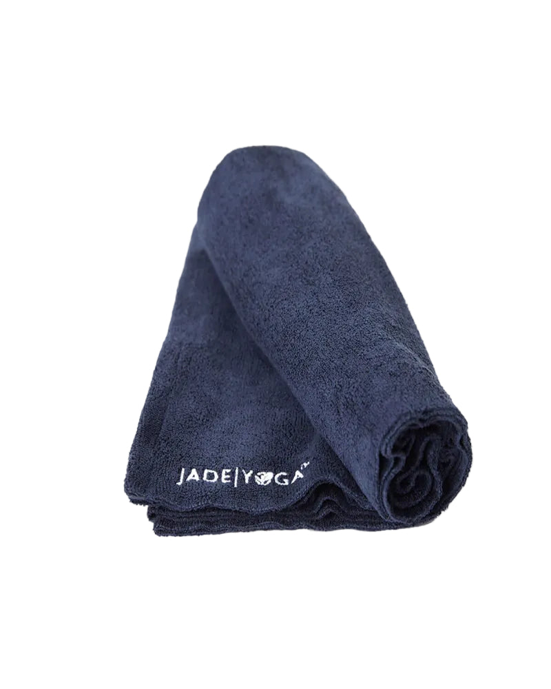Rolled-up navy yoga mat with 'Jade Yoga' logo on a white background