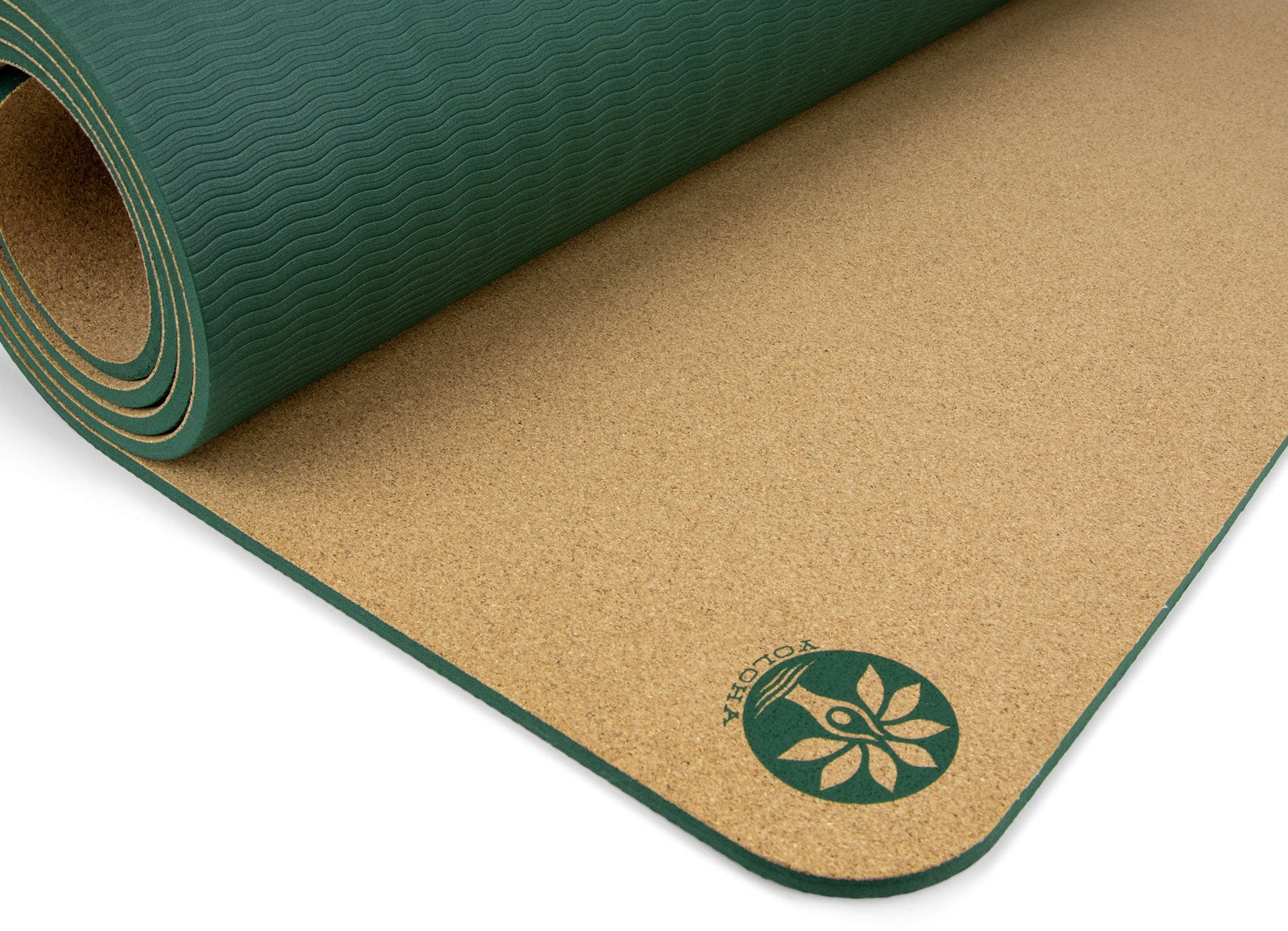 A rolled yoga mat showing its textured dark green top surface and natural tan cork-like underside, with a green circular logo printed near the corner on a white background.