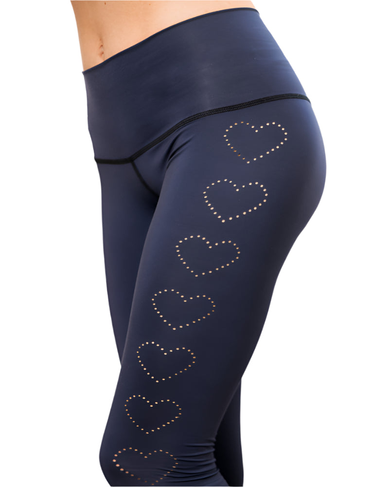 Navy blue leggings with heart patterns on a light background
