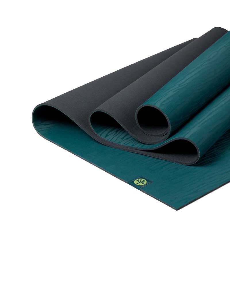 Teal yoga mat with a brand logo on a white background