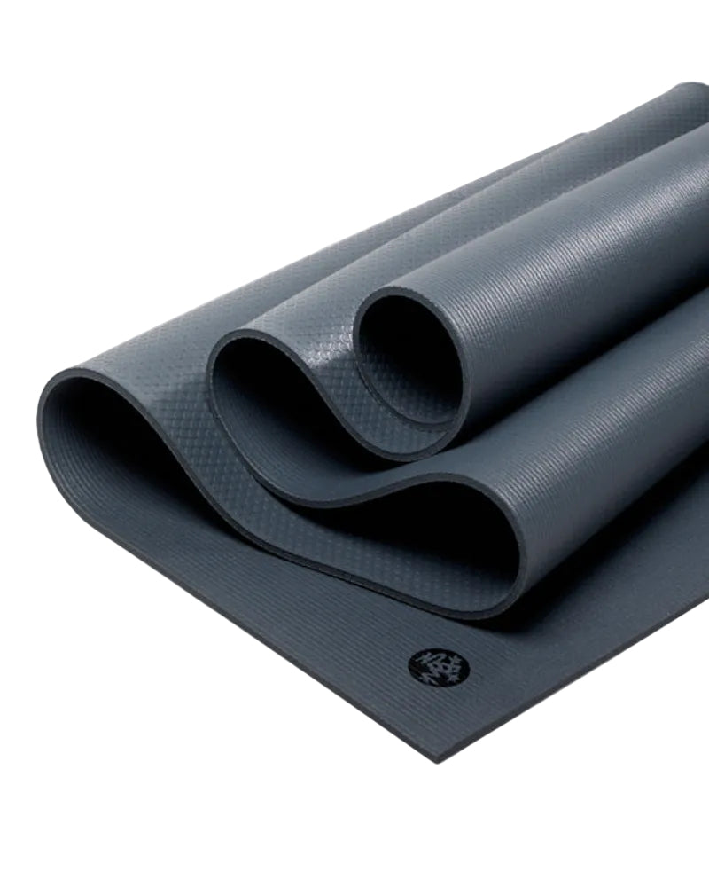 Rolling out yoga mat with brand logo on a light gray background
