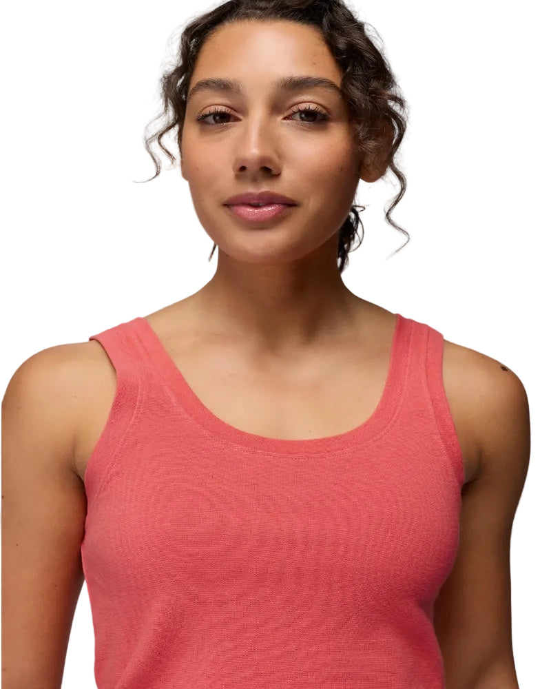 Woman wearing a pink tank top against a gray background