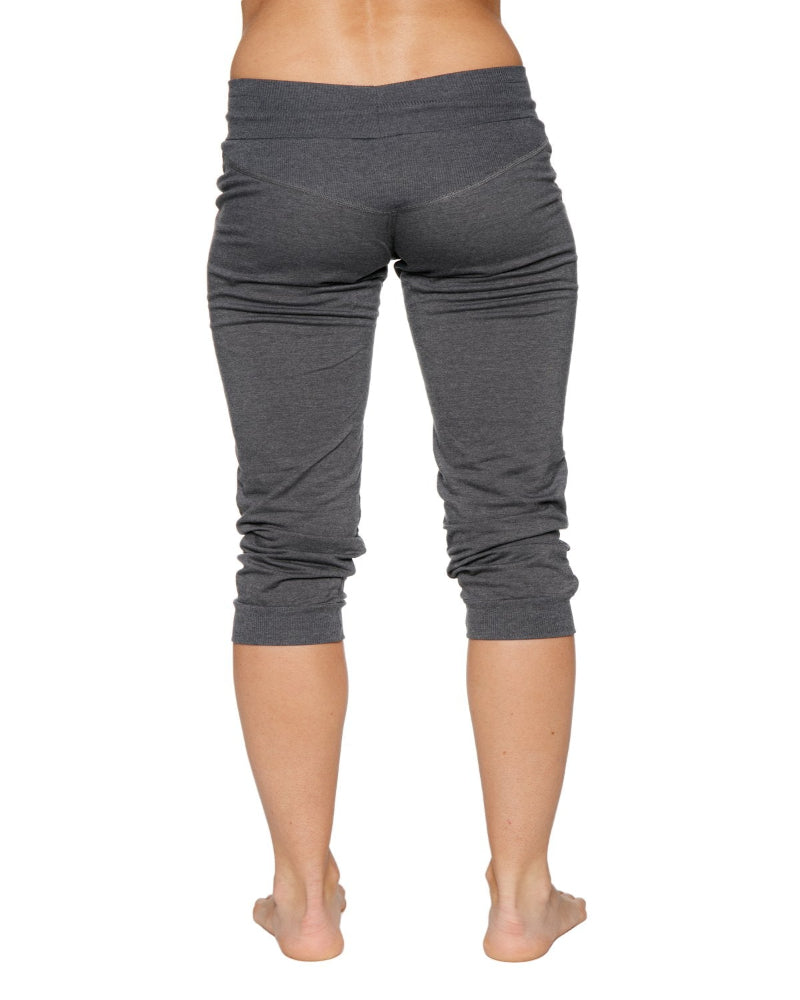 Gray capri leggings worn by a person on a white background