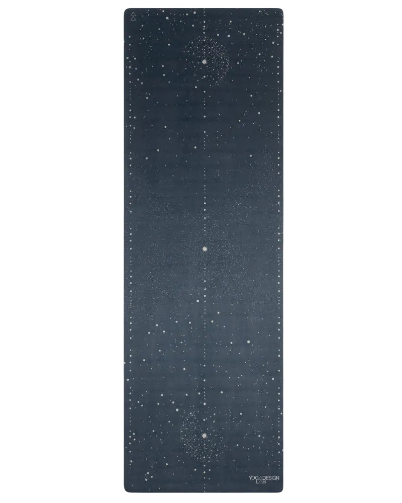 Yoga mat with starry night design on a white background