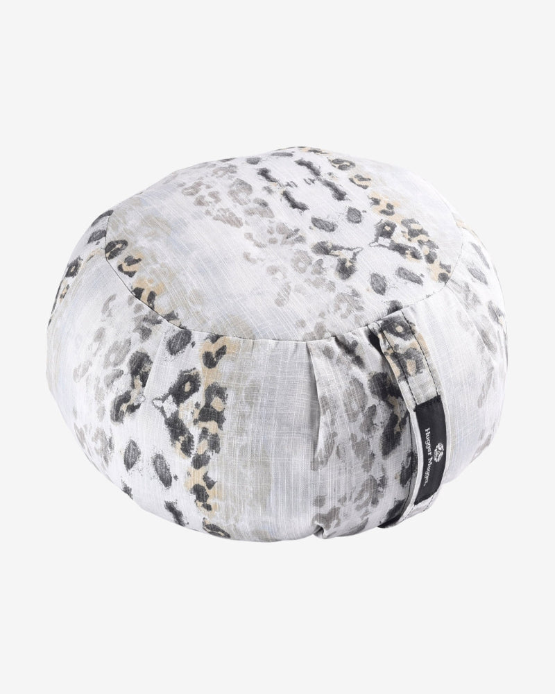 Round meditation pillow with floral pattern on a white background
