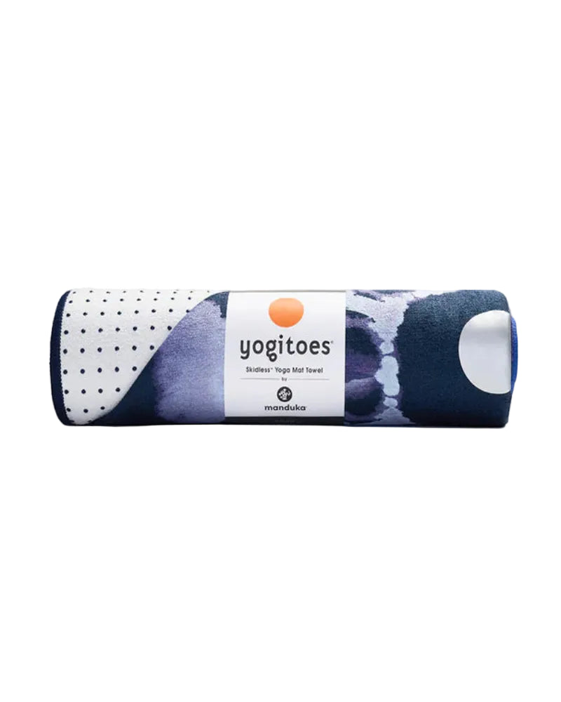 Rolled-up yoga mat with 'yogitoes' branding on a light gray background