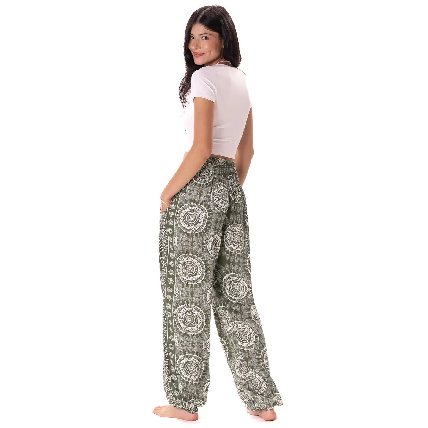 Woman wearing patterned pants on a white background