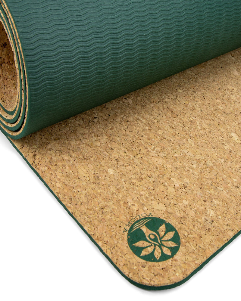 Yoga mat with gold mandala design on a black background