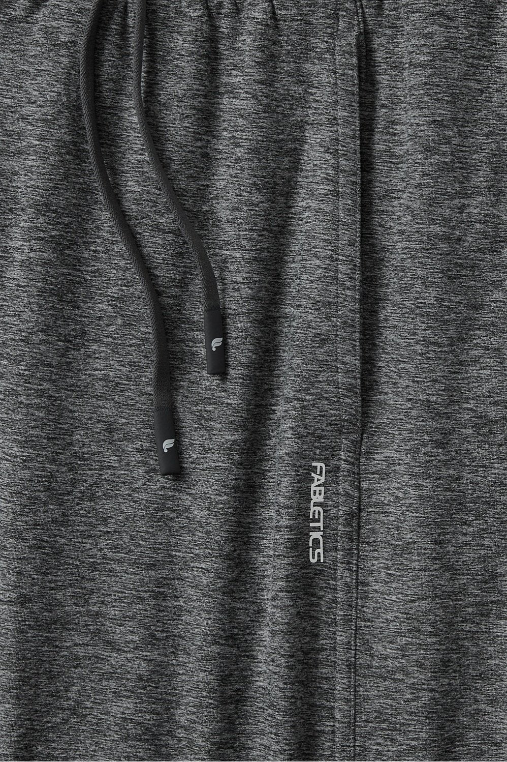 Dark gray athletic pants with a drawstring and 'Fabletics' branding.