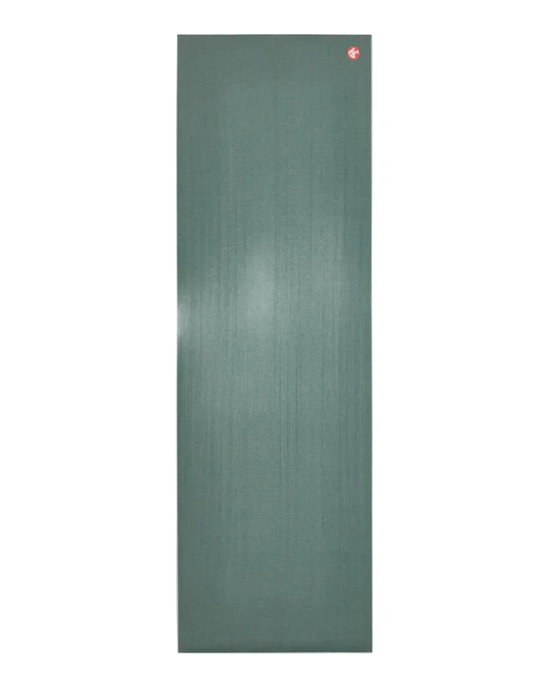Green yoga mat with a brand logo on a light gray background