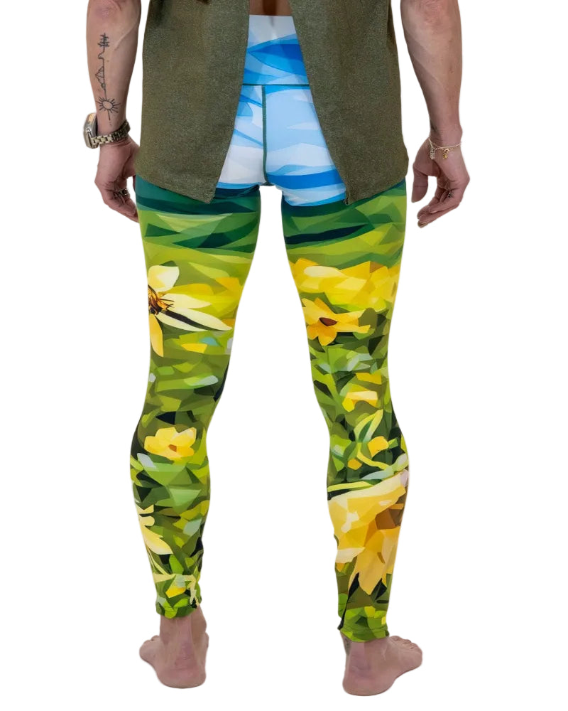 Person wearing colorful floral leggings on a white background