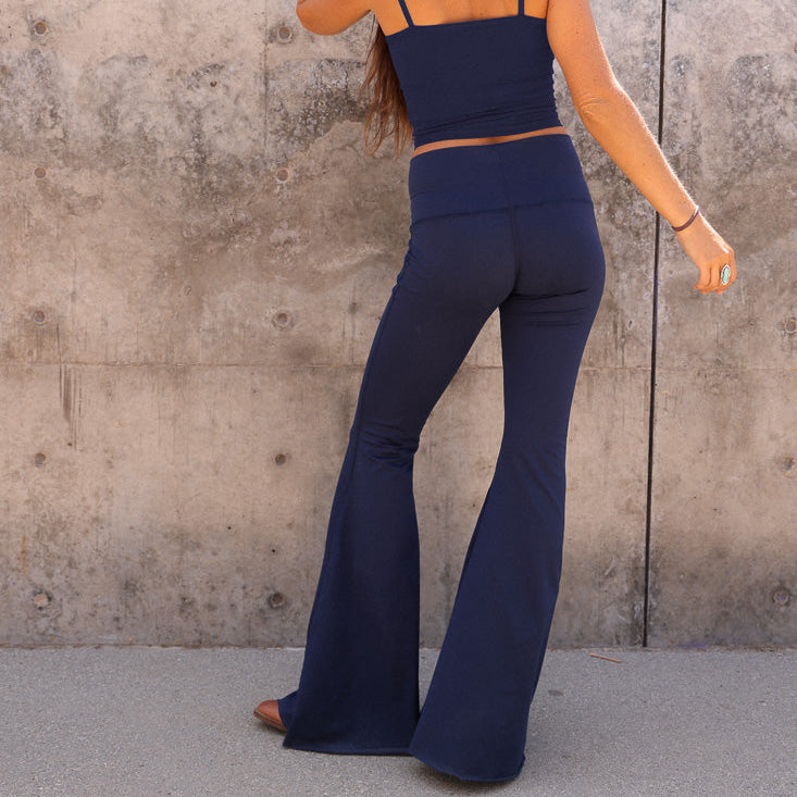 Close up of Teeki bell bottom flare pant fabric — soft recycled poly brushed jersey