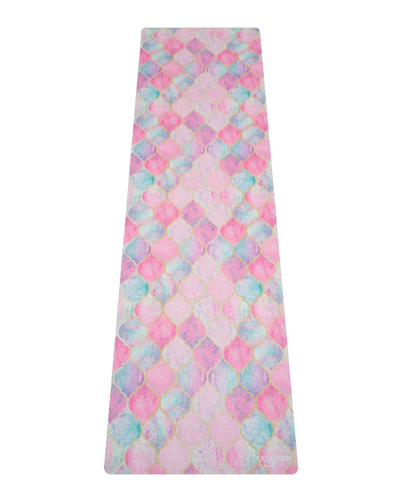 Colorful patterned fabric with pink, blue, and green hues on a white background