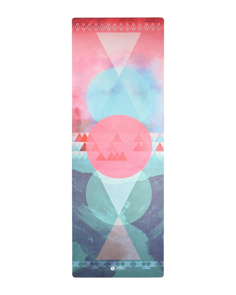 Yoga mat with geometric pink and blue design on a white background