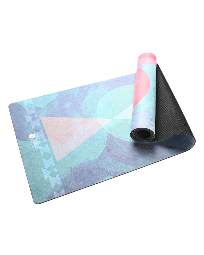 Yoga mat with geometric pink and blue design on a white background
