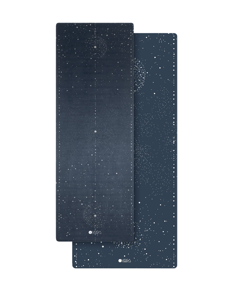 Two dark blue yoga mats with star pattern on a white background