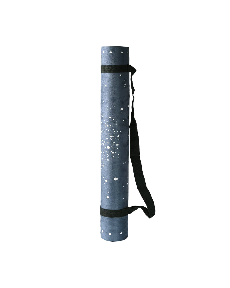 Yoga mat with star pattern and black strap on a white background