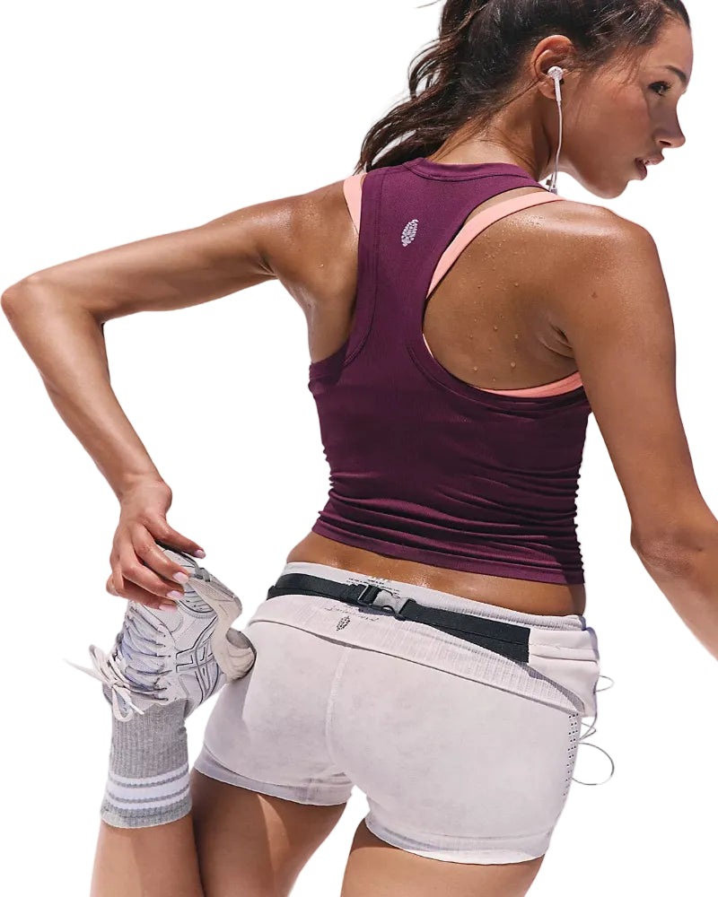 Woman in athletic wear with a white background