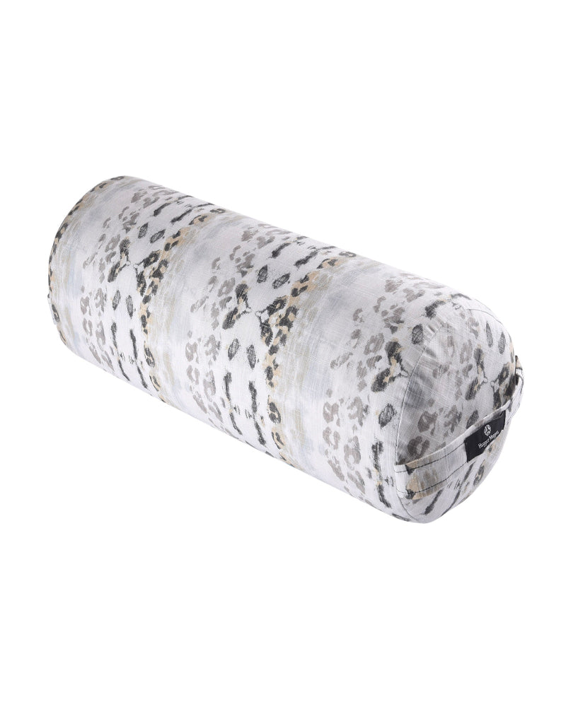 Round yoga bolster with gray leopard print pattern on a white background