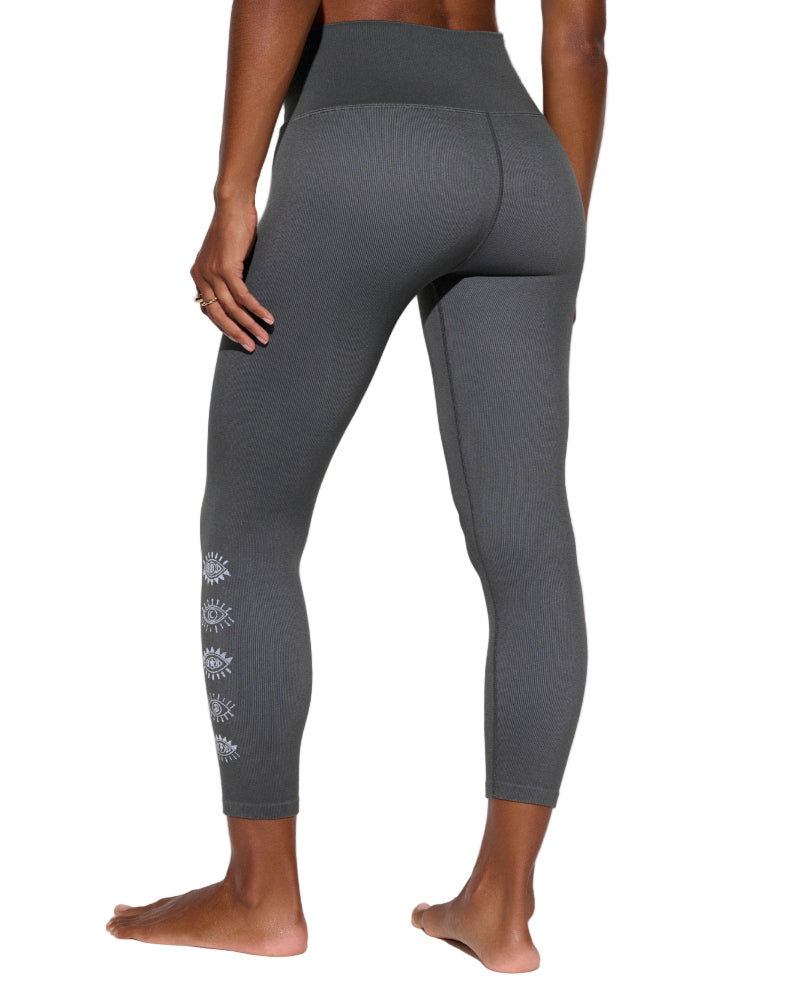 Gray leggings with a subtle design on the side, worn by a person against a neutral background