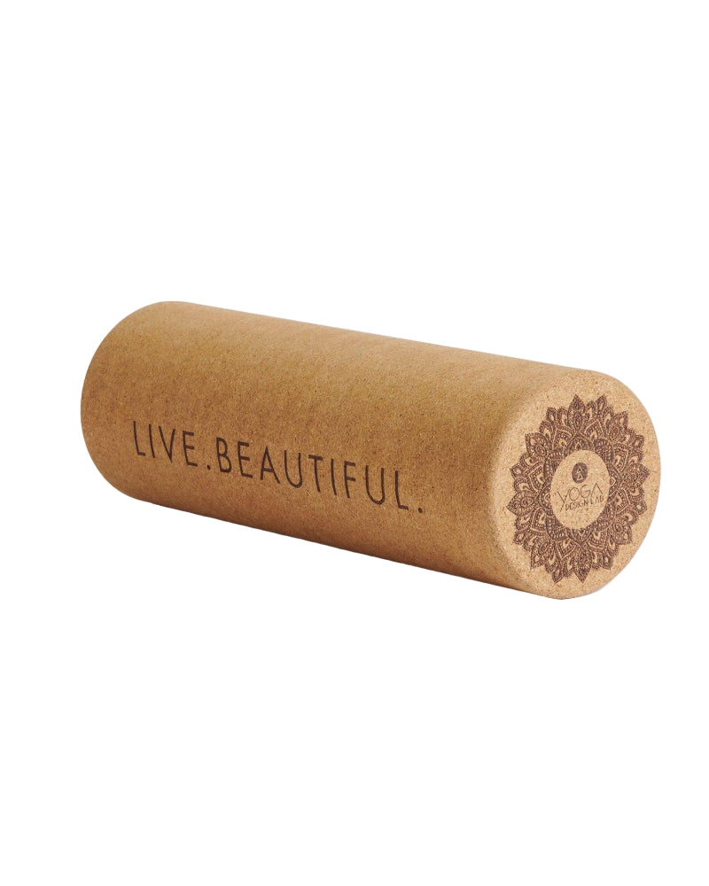 Cork yoga roller with 'Live Beautiful' text on a white background
